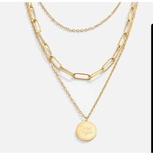 Geya coin layered necklace.